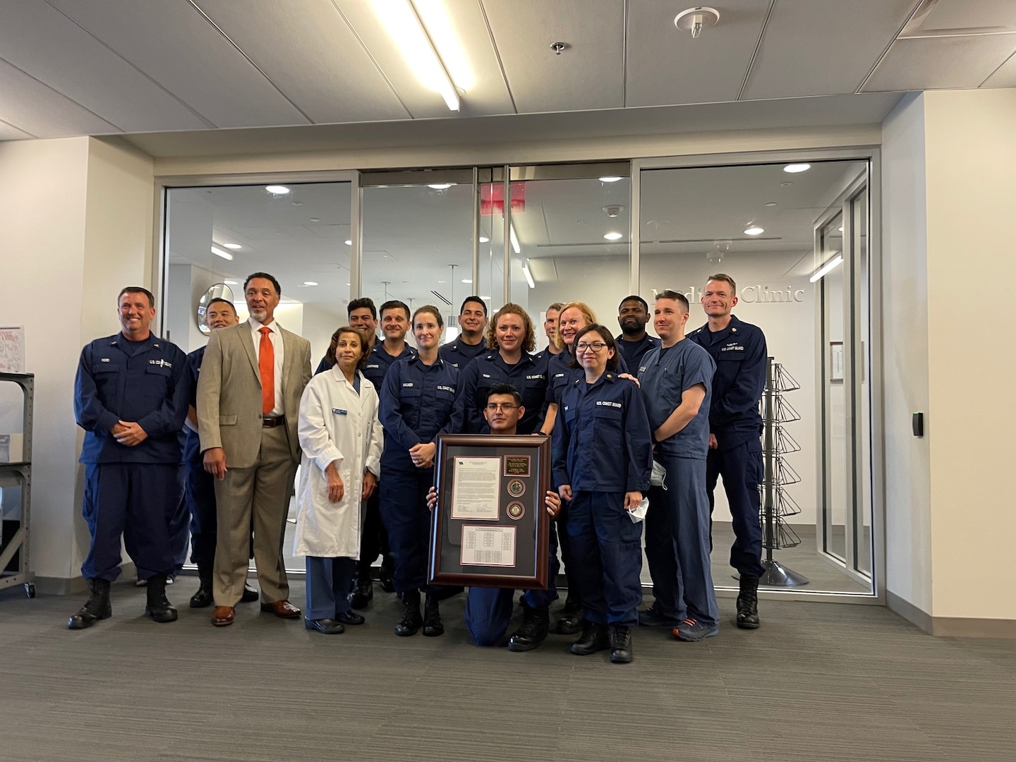 Members of Base National Capital Region receive their specific Health Clinic of the Year award, July 21, 2021. Every Coast Guard clinic will be recognized as the clinic of the year for 2020 based on how well the medical community responded to a global pandemic as well as hurricanes in 2020. U.S. Coast Guard photo by Keisha Reynolds.