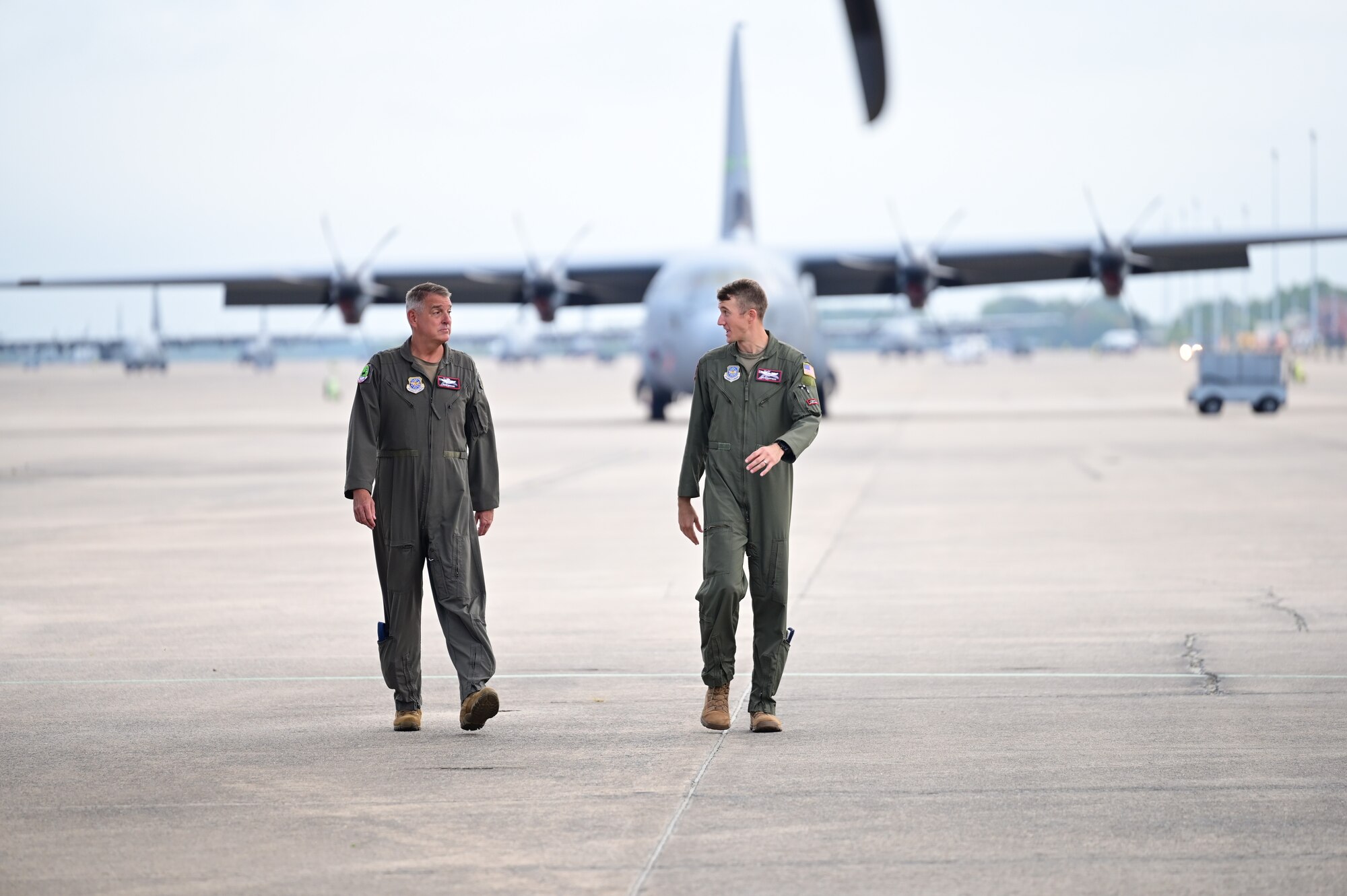 Two people talk while performing a pre-flight check
