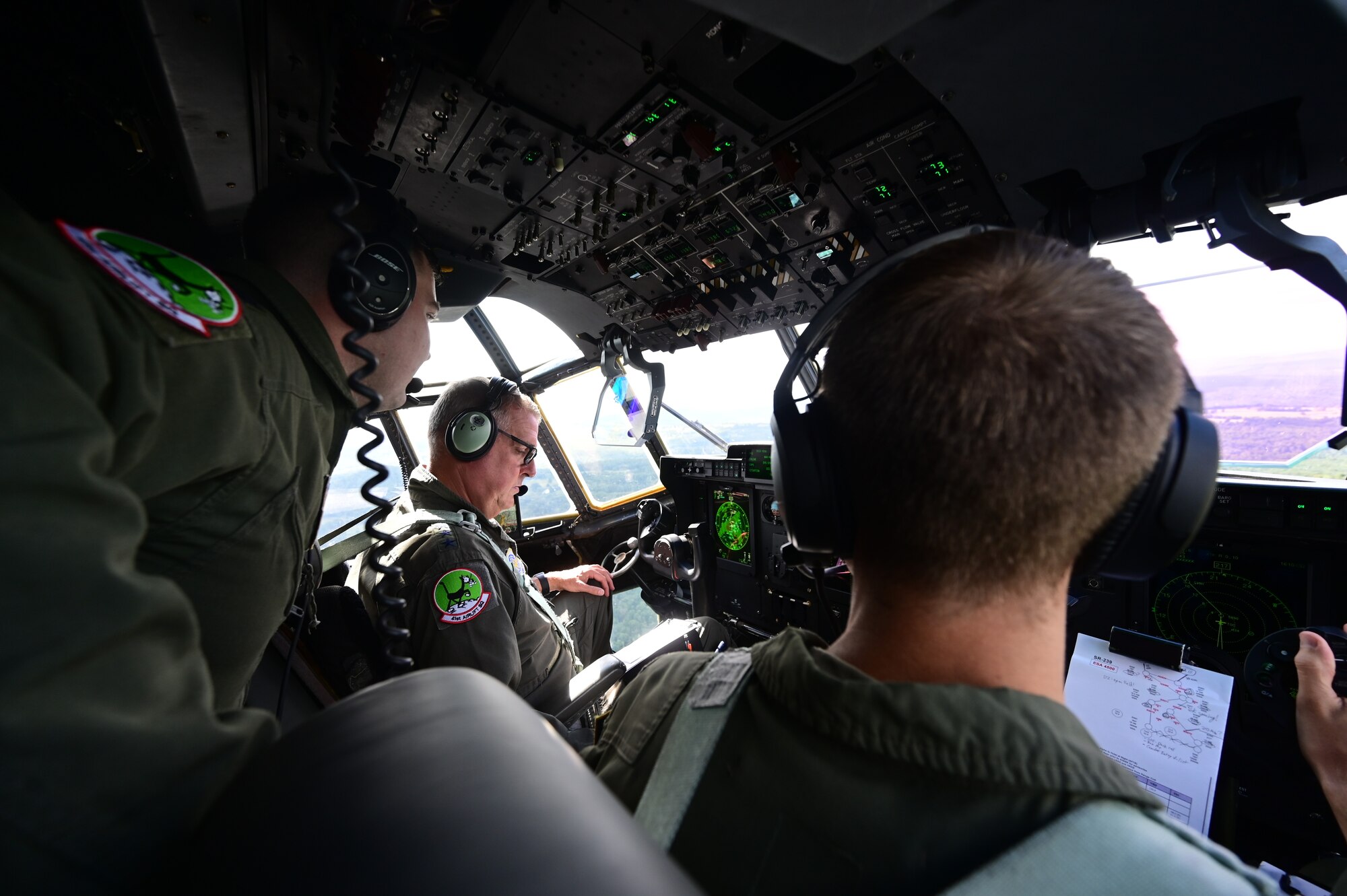 A group of people pilot a C-130J