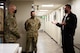 From left to right, U.S. Air Force Col. David Berkland, the 354th Fighter Wing commander, and Master Sgt. Christopher Brown, the 354th Civil Engineering Squadron (CES) deputy fire chief, listen to Brad Eveland, the 354th CES assistant chief of fire prevention, on Eielson Air Force Base, Alaska, Sept. 17, 2021.