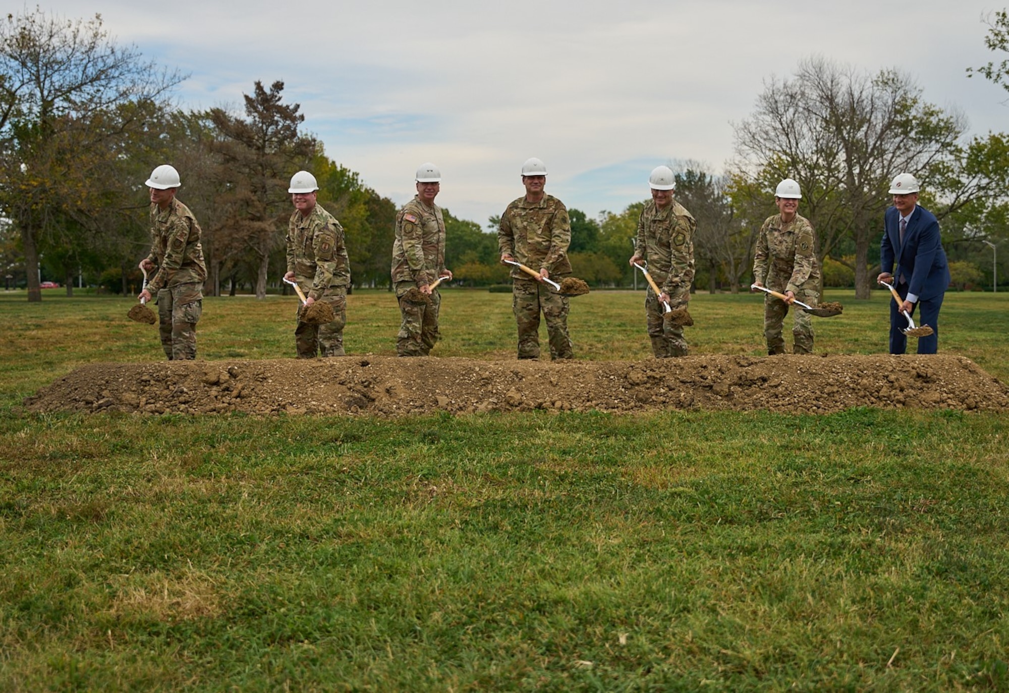 military leaders and construction president break ground