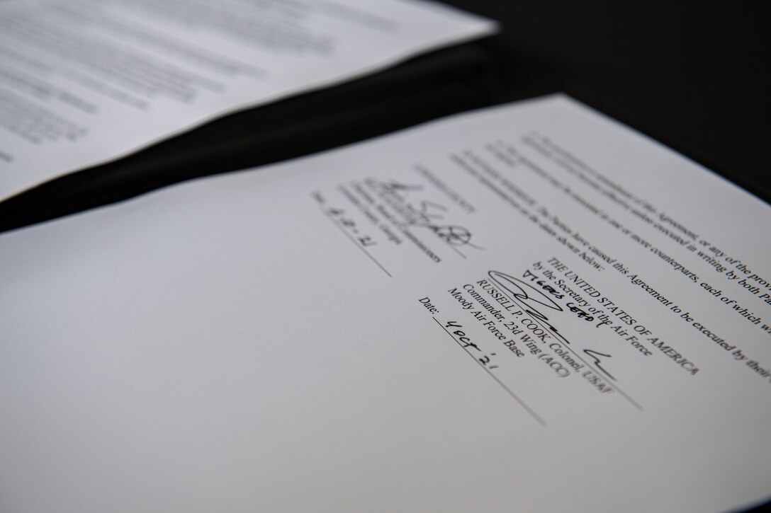 Two signatures on a paper