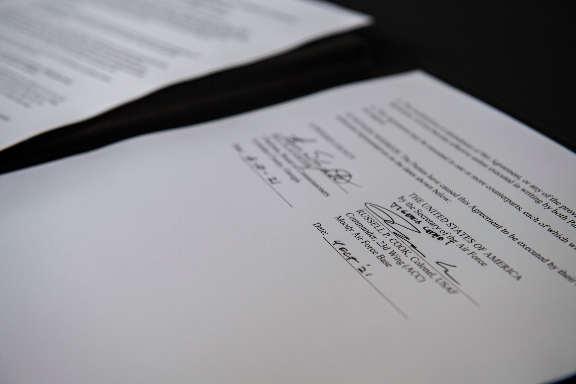 Two signatures on a paper