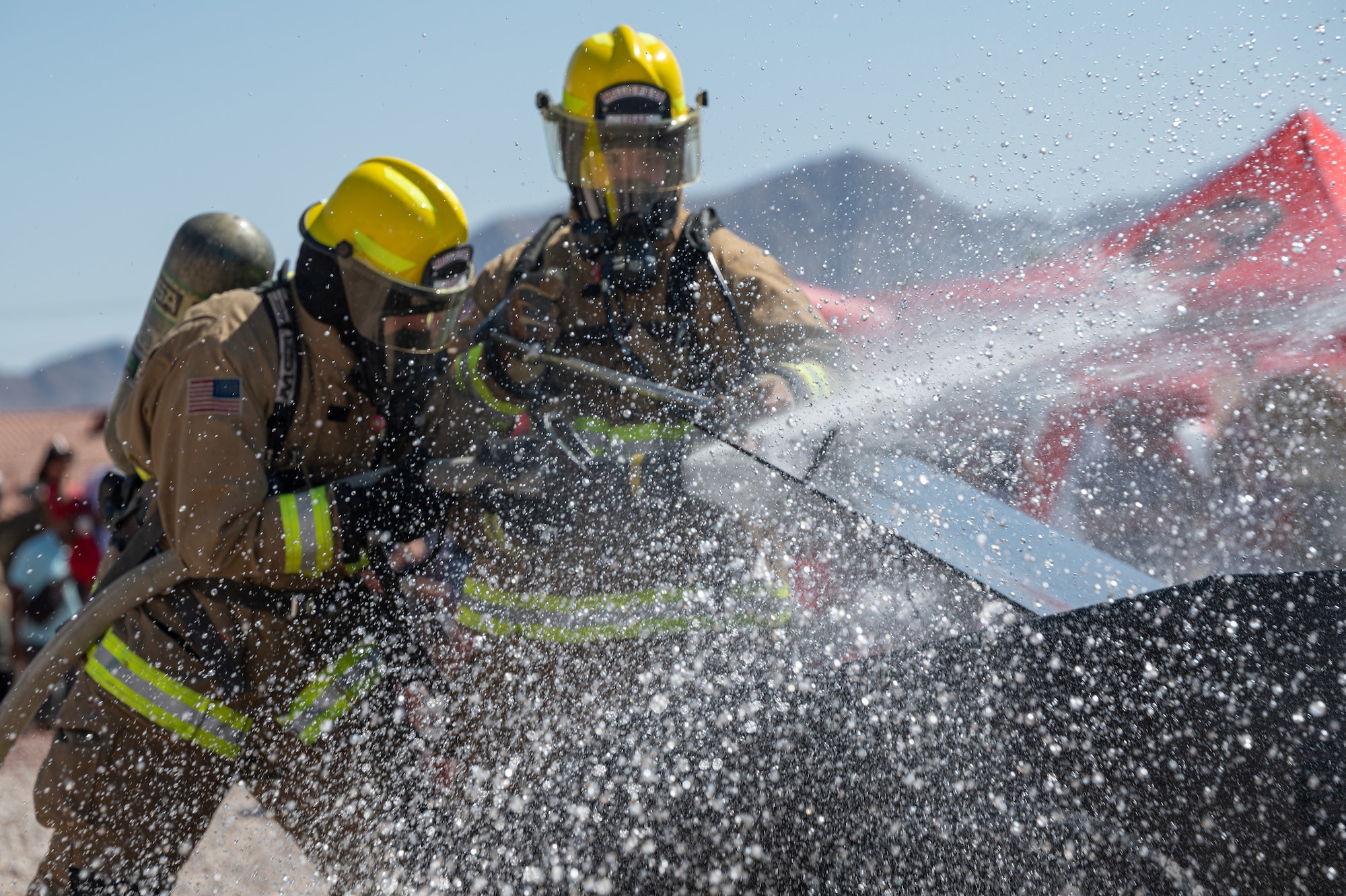 Firefighters with hose