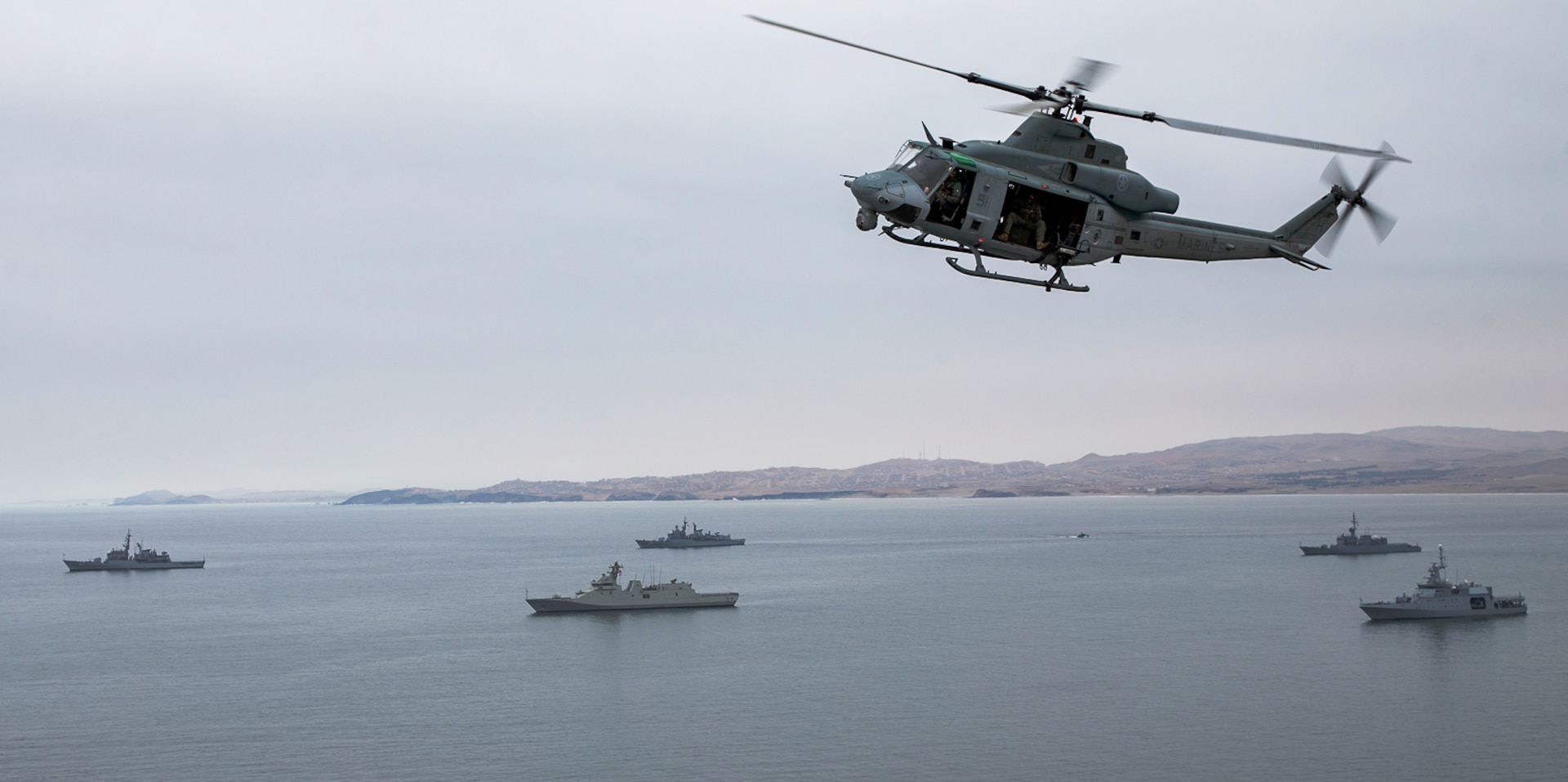 U.S. Marines with Special Purpose Marine Air-Ground Task Force - UNITAS operate a UH-1Y Venom helicopter during an amphibious landing as part of UNITAS LXII in Salinas, Peru, Oct. 2, 2021.