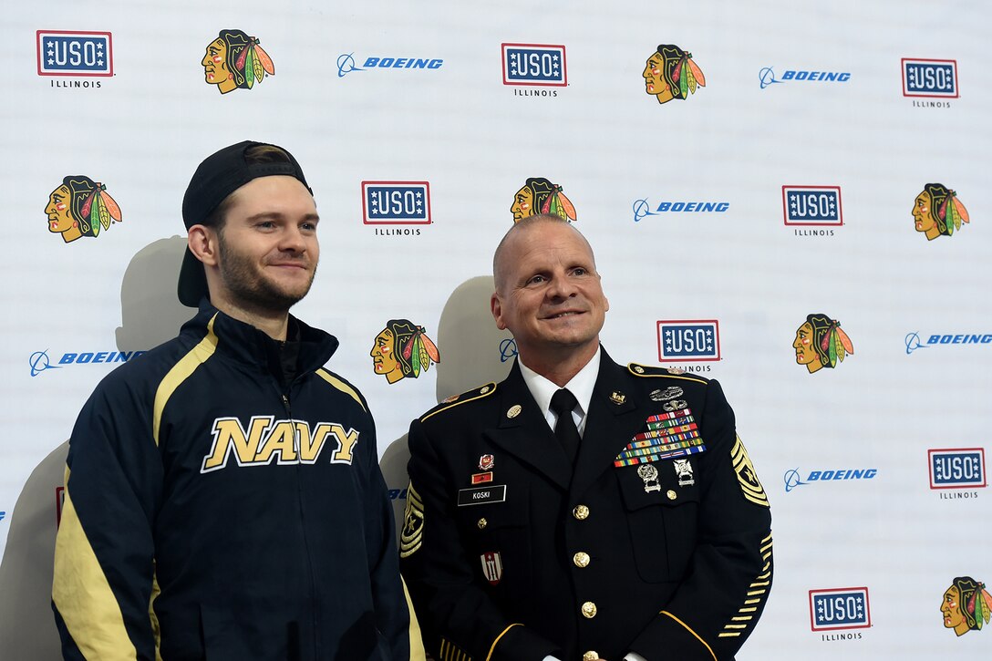 Chicago Blackhawks National Hockey League team honors Sgt. Maj. Dennis Koski, right, 85th U.S. Army Reserve Support Command, and U.S. Navy Veteran Lt. j.g. Ash Davis, during a home game, at the United Center in Chicago, October 1, 2021.