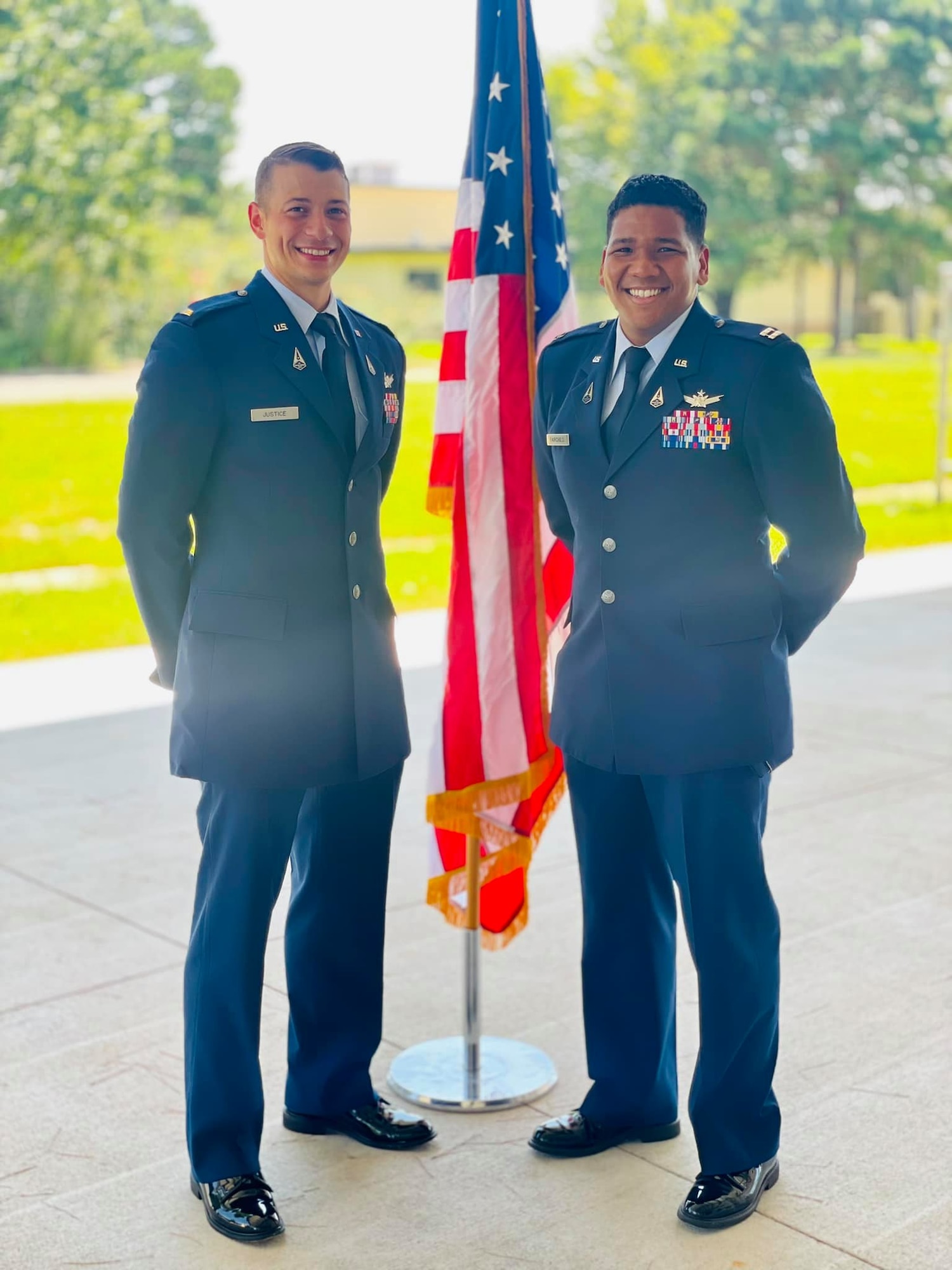 Men pose for a photo
