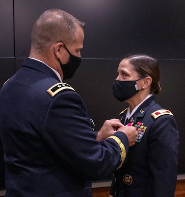 Col. Melissa Beauman, of Glenarm, Illinois, is presented the Legion of Merit by Maj. Gen. Eric Little, National Guard Bureau Manpower and Personnel Directorate, during Beauman’s retirement ceremony Oct. 1 at the Illinois Military Academy, Camp Lincoln, Springfield, Illinois.