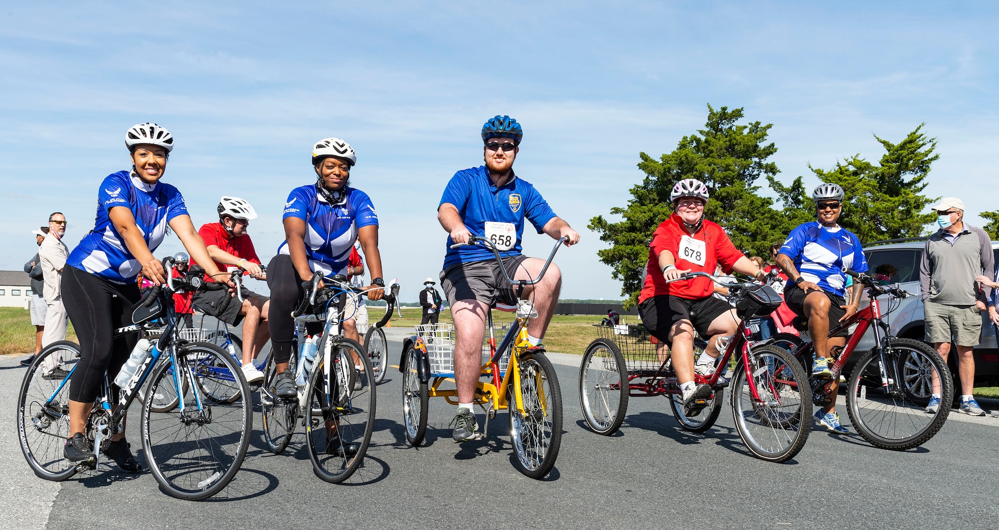 Maj. Michelle Rogers, left, 512th Force Support Squadron commander; Master Sgts. Mercedes McCoy-Garrett, second from left, 512th Mortuary Affairs Squadron readiness supervisor; and Heather Baptiste, right, 512th FSS in-service recruiter, line up with cyclists during the 2021 Special Olympics Delaware Cycling Classic at Dover Air Force Base, Delaware, Oct. 2, 2021. The trio rode with participants during the 5K tricycle race. (U.S. Air Force photo by Roland Balik)