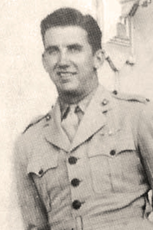 A man in uniform poses for a photo.