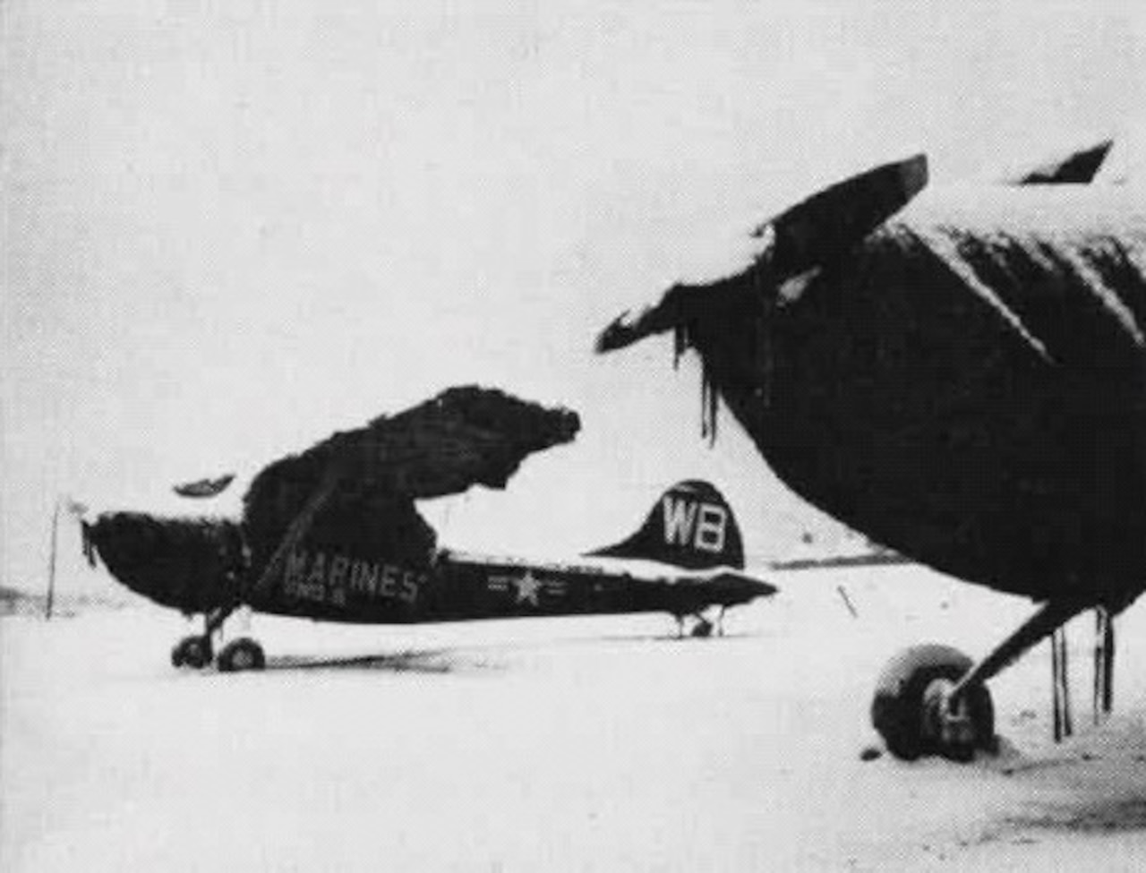 An aircraft is parked in the snow.