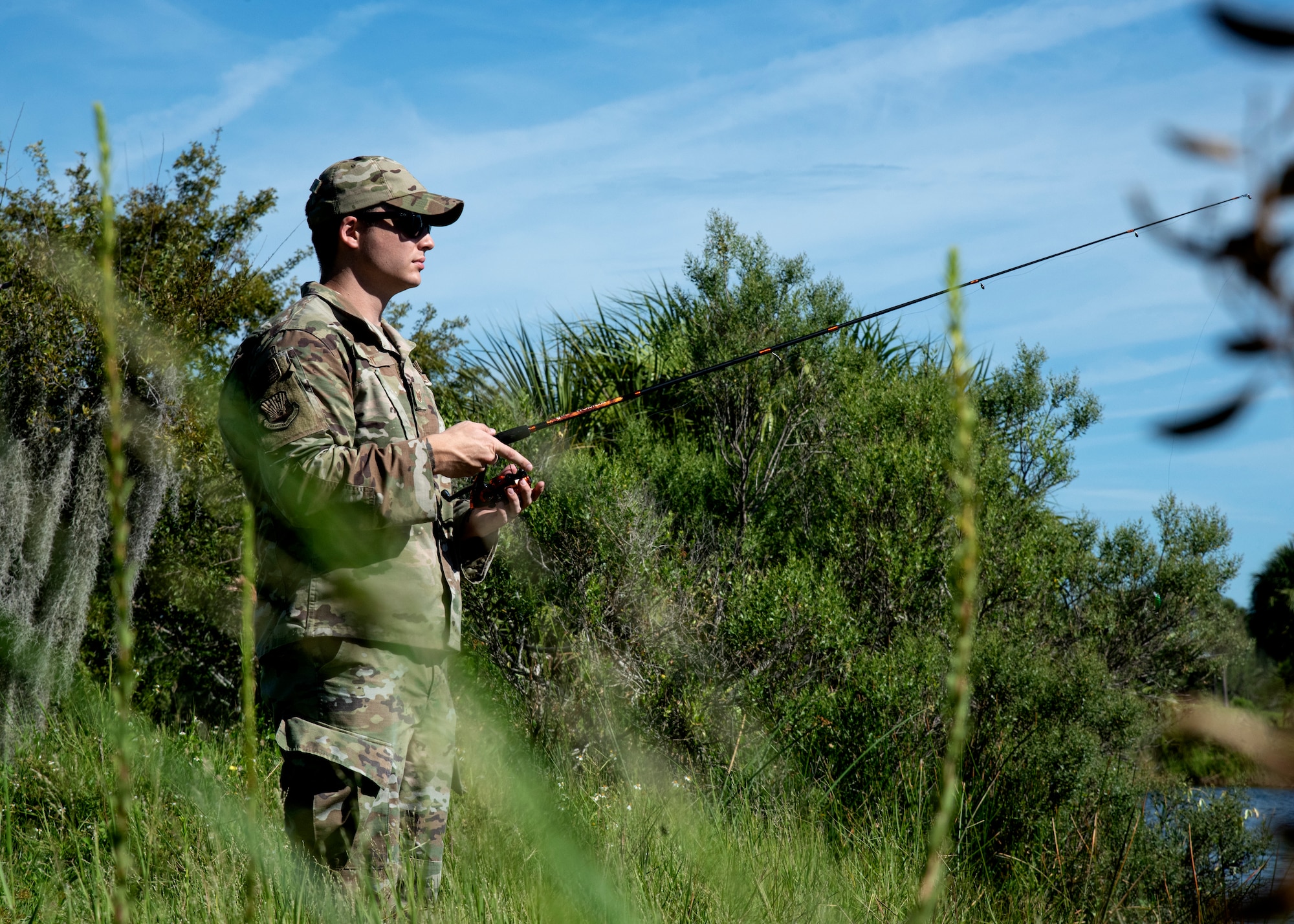 U.S. Air Force Tech. Sgt. Joshua Smoot, the 6th Air Refueling Wing Public Affairs NCOIC of mission partner support, fishes at Lewis Lake on MacDill Air Force Base, Florida, Oct. 1, 2021.