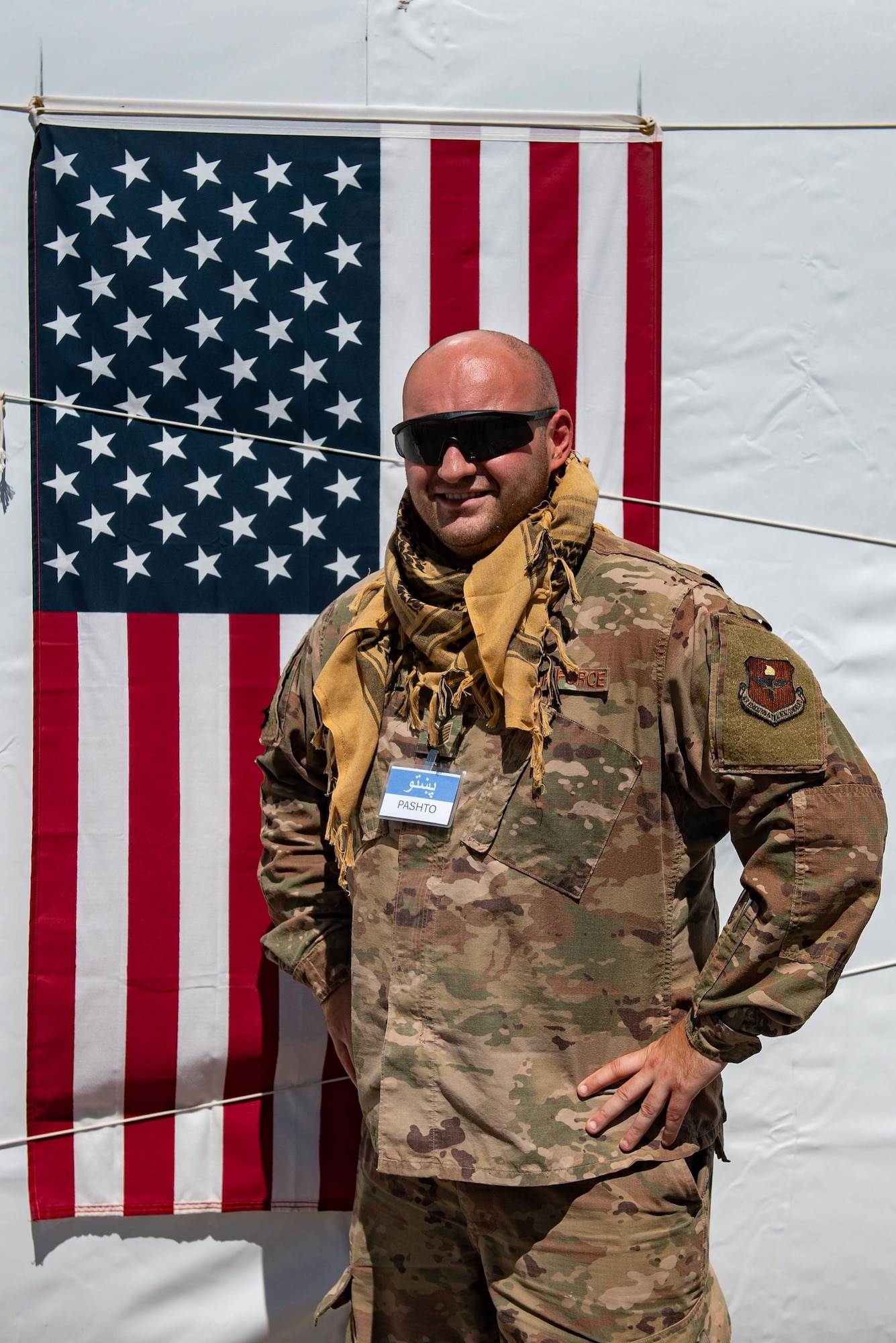 Tech. Sgt. Steven Toma, Task Force-Holloman interpreter deployed from Goodfellow Air Force Base, Texas, poses for a photo at Aman Omid Village on Holloman Air Force Base, New Mexico, Sept. 23, 2021. The Department of Defense, through U.S. Northern Command, and in support of the Department of State and Department of Homeland Security, is providing transportation, temporary housing, medical screening, and general support for at least 50,000 Afghan evacuees at suitable facilities, in permanent or temporary structures, as quickly as possible. This initiative provides Afghan evacuees essential support at secure locations outside Afghanistan. (U.S. Air Force photo by Staff Sgt. Kenneth Boyton)