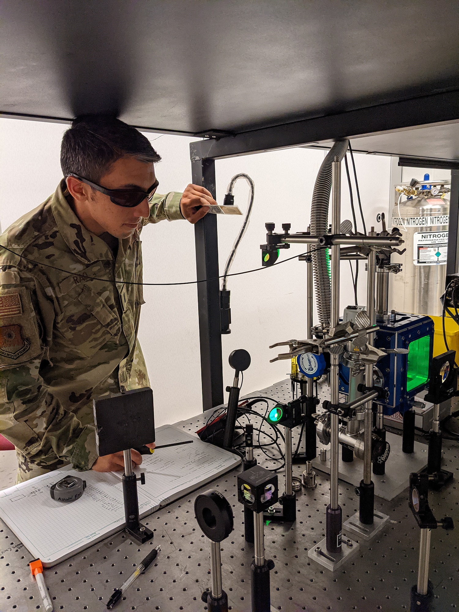 First Lt. Ashwin Rao checks equipment alignment for his laser-induced breakdown spectroscopy experiments at the Air Force Institute of Technology, Wright-Patterson Air Force Base, Ohio.
