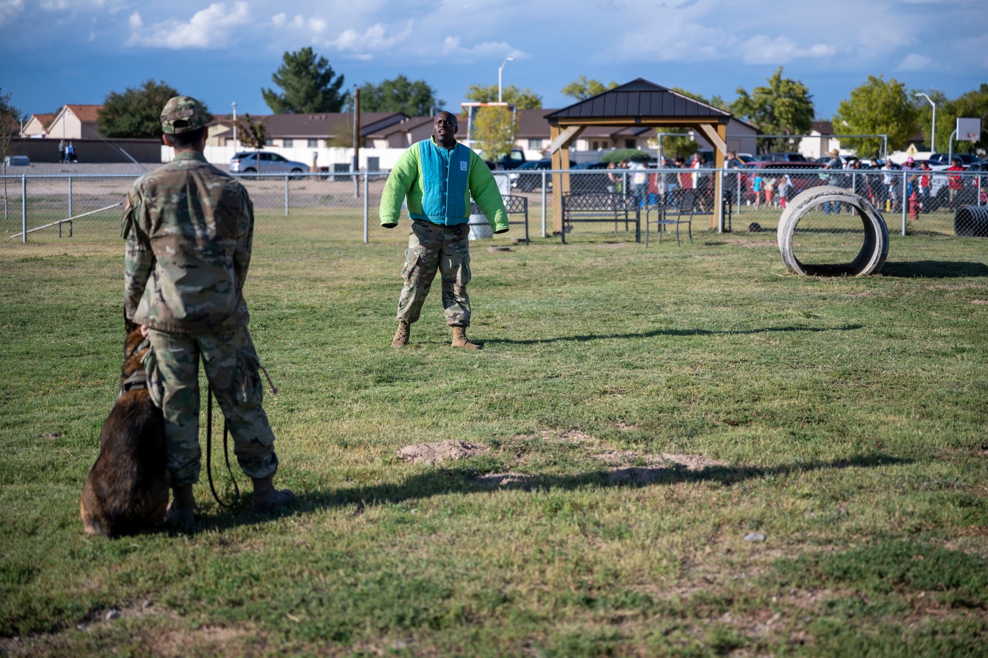 Staff Sgt. Benjamin Huntley, 49th Security Forces Squadron military working dog handler, practices resisting arrest with Staff Sgt. David Ebling, 49th SFS military working dog handler Oct. 1, 2021 on Holloman Air Force Base, N.M. Military working dogs are trained for specific jobs, to include tracking, explosive detection, patrol and search and rescue. (U.S. Air Force photo by Senior Airman Kristin Weathersby)