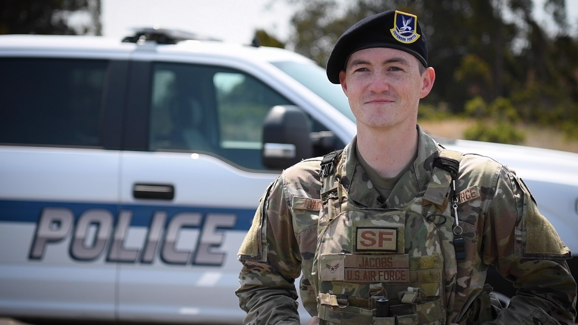 Airman 1st Class Austin Jacobs, stands in front of his security forces vehicle, July 14, 2021 at Vandenberg Space Force Base, Calif., as he speaks about the day he rescued Mr. George Metzger retired U.S. Army. (U.S. Space Force Photo by Airman 1st Class Rocio Romo)