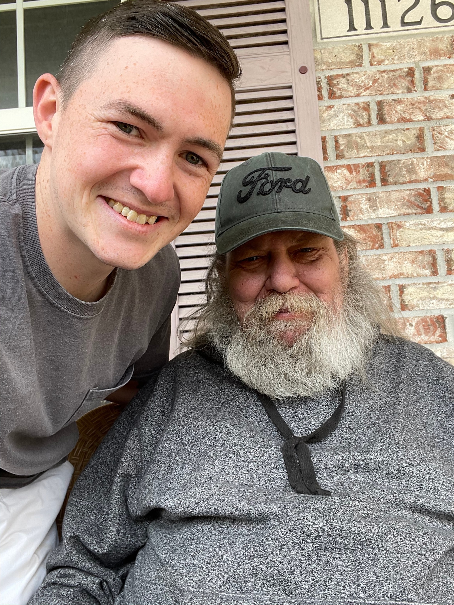 Airman 1st Class Austin Jacobs visits his neighbor, George Metzger after being released from the hospital in his hometown of Indiana on Apr. 16, 2021 (Courtesy Photo)