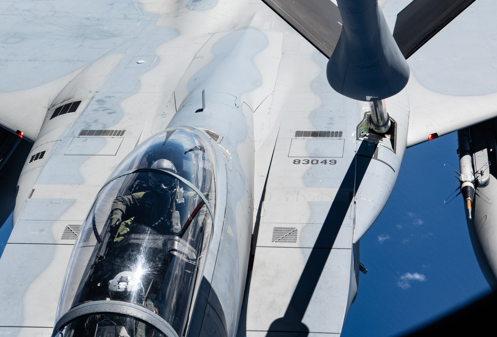 Boom operators from the 909th Air Refueling Squadron refuel F-15C Eagles.