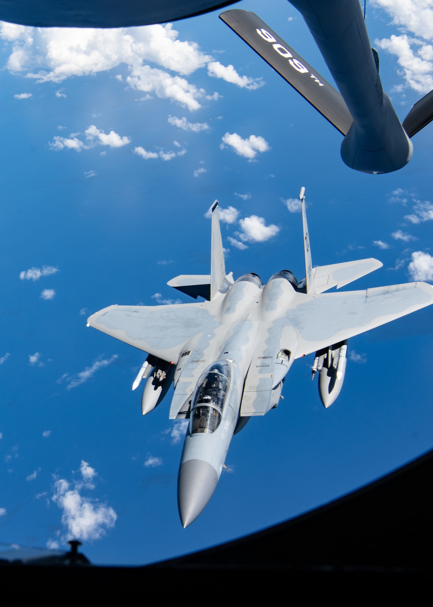 Boom operators from the 909th Air Refueling Squadron refuel F-15C Eagles.