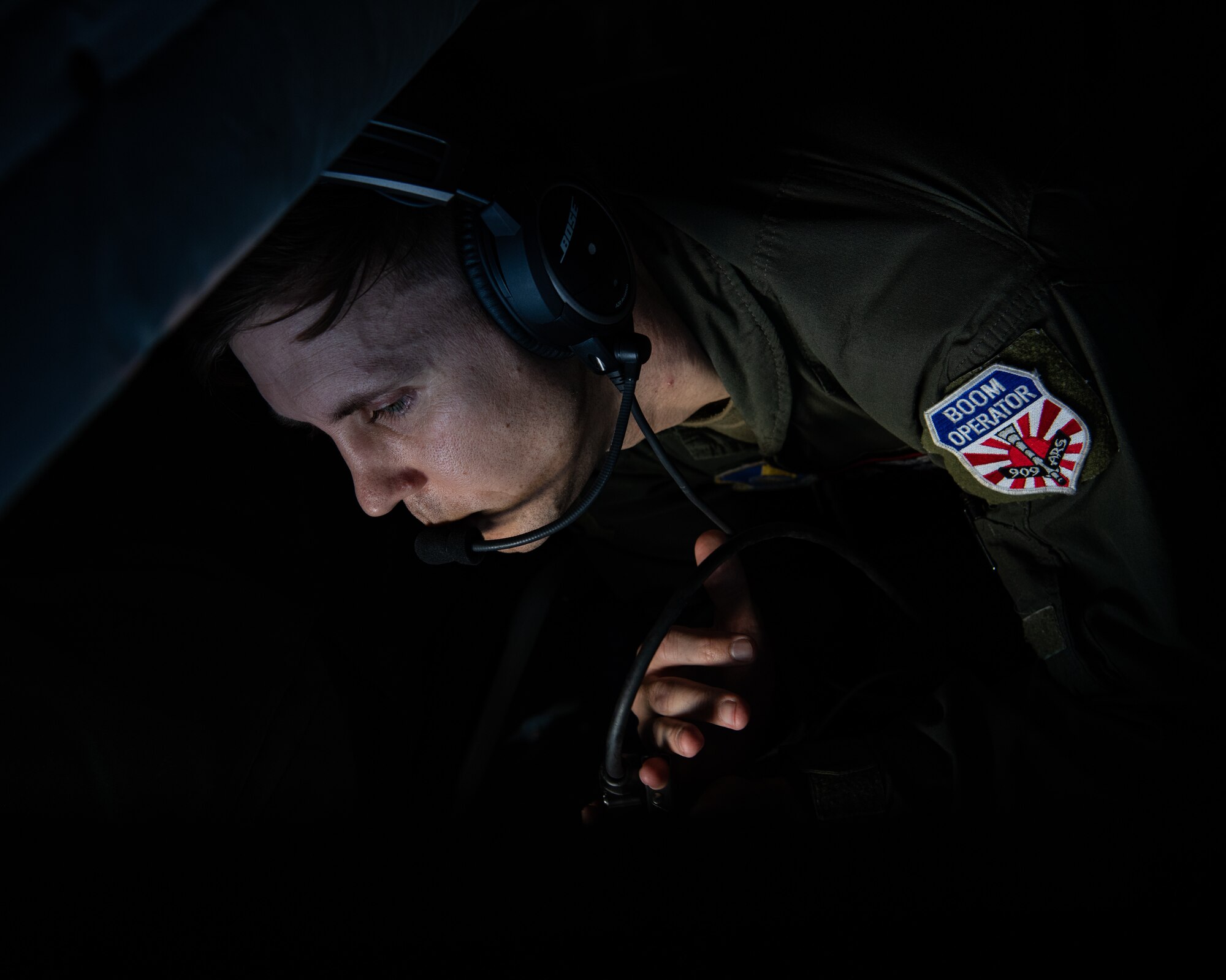 Boom operators from the 909th Air Refueling Squadron refuel F-15C Eagles.