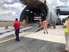 A donated firetruck is offloaded for use by the Boberos de Esteli, a firefighting organization from the mountainous area of northern Nicaragua. The Wisconsin National Guard helps support Denton Flights, an aid program that uses U.S. military aircraft as space is available to transport relief supplies, as part of its State Partnership Program relationship with Nicaragua.