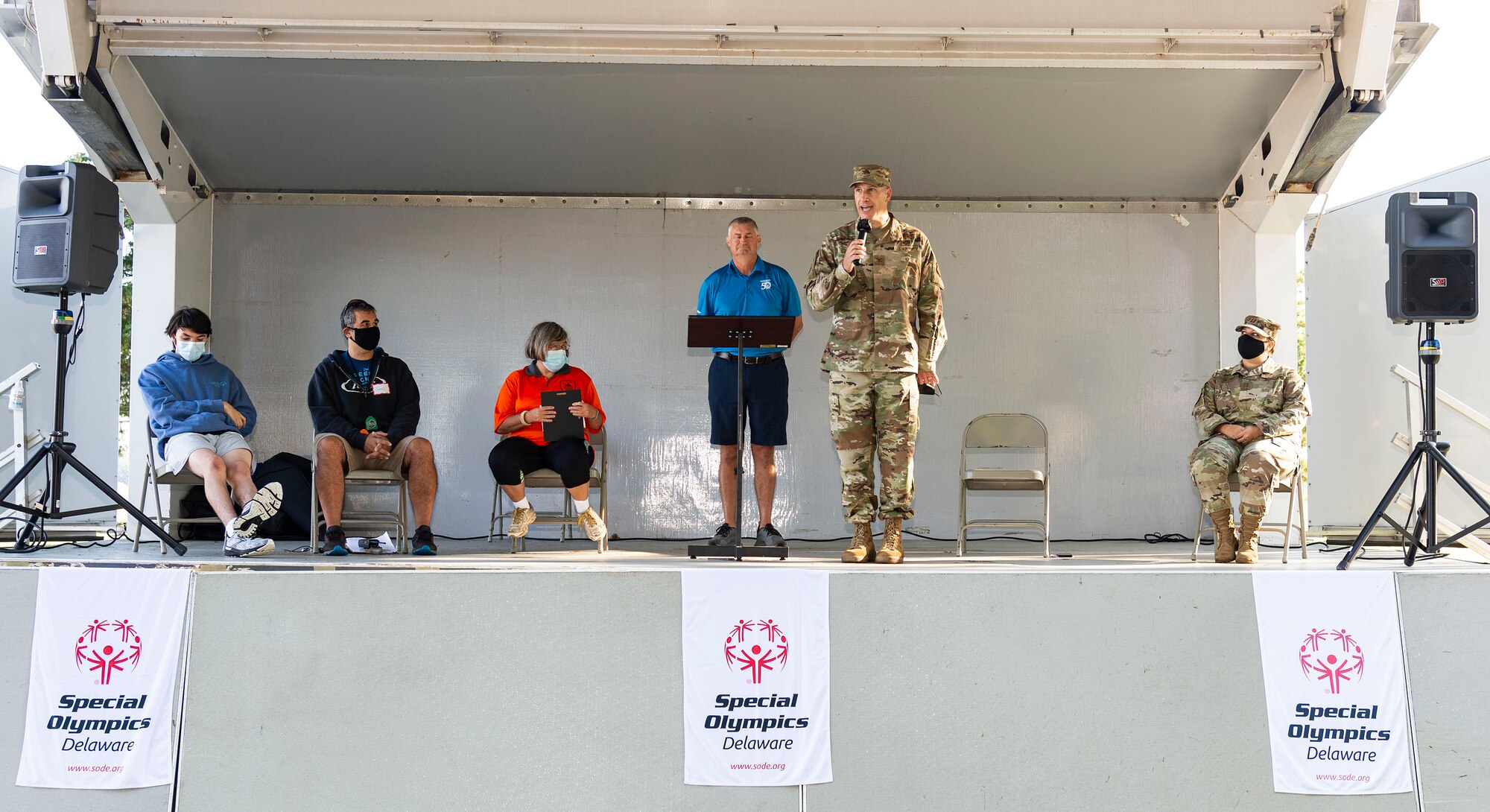 Col. Matt Husemann, 436th Airlift Wing commander, gives opening remarks at the 2021 Special Olympics Delaware Cycling Classic at Dover Air Force Base, Delaware, Oct. 2, 2021. Team Dover senior leadership presented medals to the top three finishers in each event. More than 90 volunteers helped with setting up race courses and recording individual times of competitors. (U.S. Air Force photo by Roland Balik)