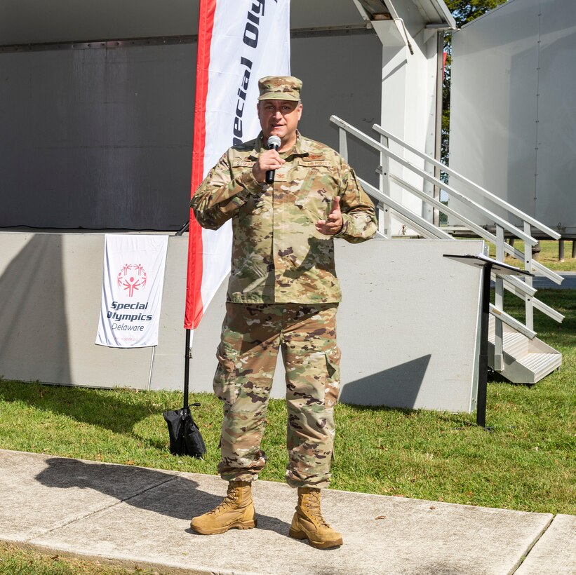 Col. Douglas Stouffer, 512th Airlift Wing commander, makes closing remarks at the 2021 Special Olympics Delaware Cycling Classic at Dover Air Force Base, Delaware, Oct. 2, 2021. Stouffer noted the return of the cycling classic to Dover AFB after last year's absence due to the pandemic. (U.S. Air Force photo by Roland Balik)