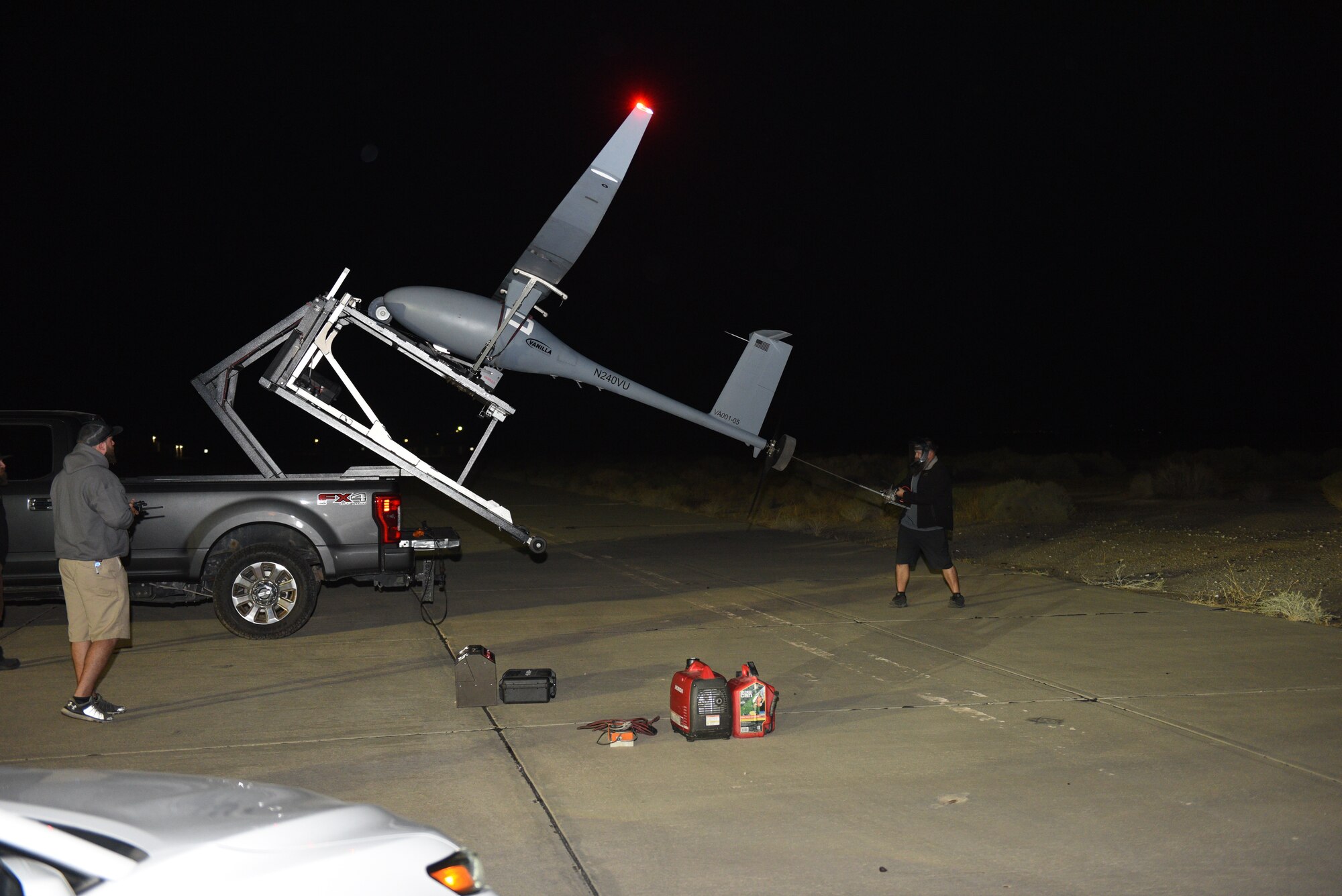 Platform Aerospace personnel prepare a Vanilla unmanned aircraft system for its record-breaking flight at Edwards Air Force Base, California, Sept. 24. The aircraft broke the world record for unrefueled, internal combustion endurance of an unmanned aircraft with a total continuous flight time of 8 days, 50 minutes, and 47 seconds, and 12,200 miles, Oct. 2. (Air Force photo by Bryce Bennett)