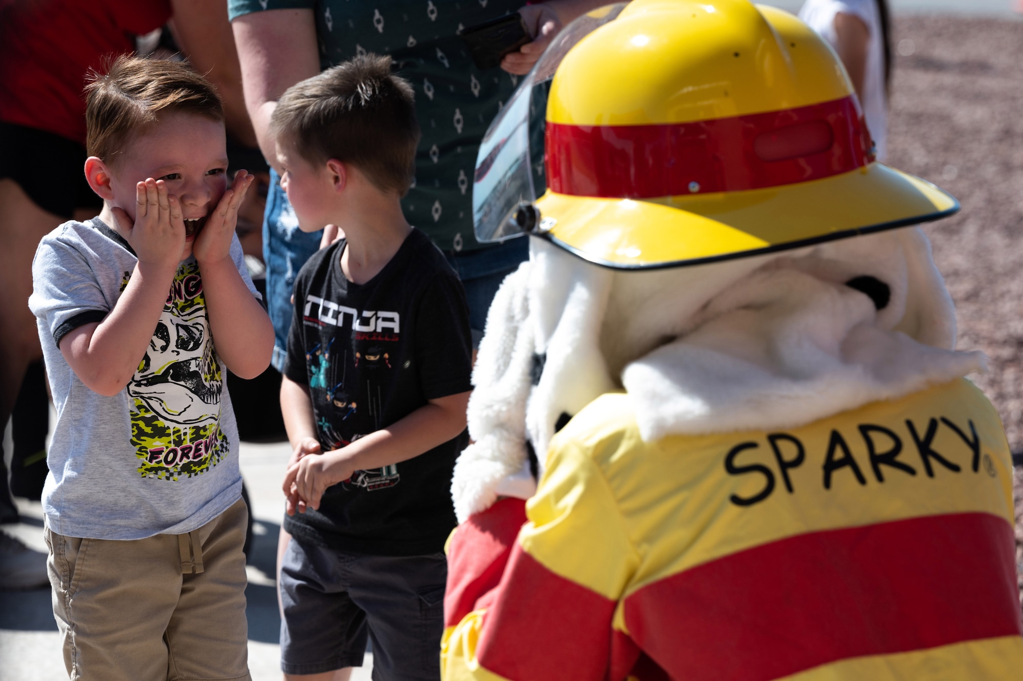 kid excited to see dog mascot