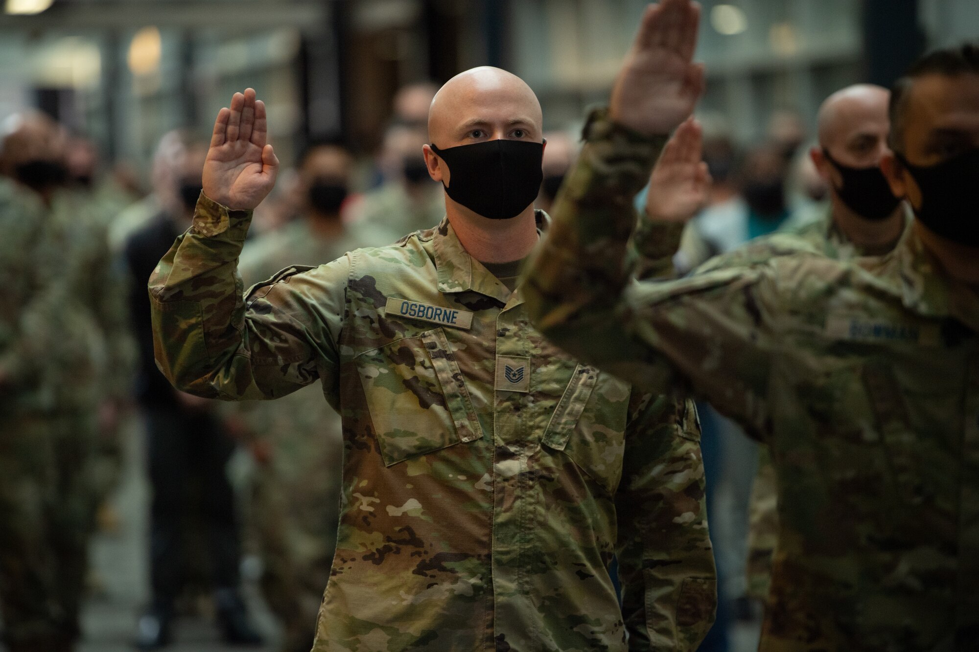 Tech. Sgt. Brandon Osborne takes the oath of enlistment as one of the first members of the U.S. Army transfer into the U.S. Space Force Oct. 1, 2021, at Peterson Space Force Base, Colorado.