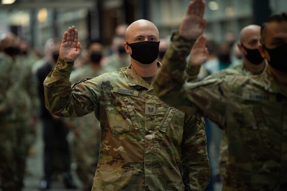 Tech. Sgt. Brandon Osborne takes the oath of enlistment as one of the first members of the U.S. Army transfer into the U.S. Space Force Oct. 1, 2021, at Peterson Space Force Base, Colorado.