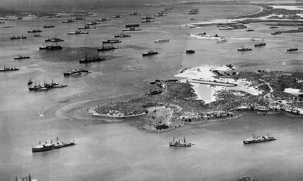 Aerial photo of Guantanamo Bay Naval Station in early 1940s, showing the fleet at anchor and seaplane ramp in the foreground. (U.S. Navy photo)