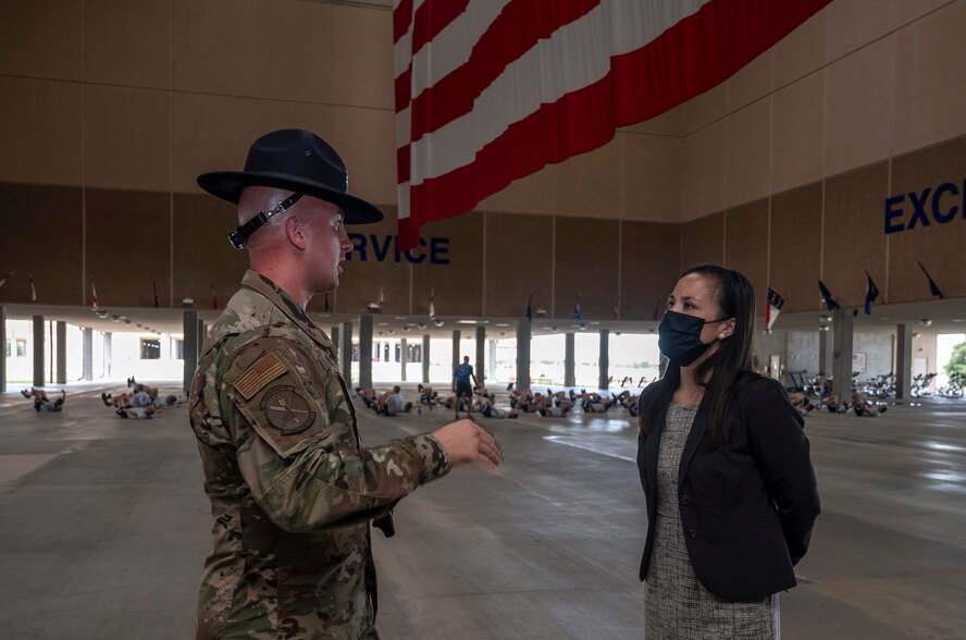 Undersecretary of the Air Force talking to an Airman.