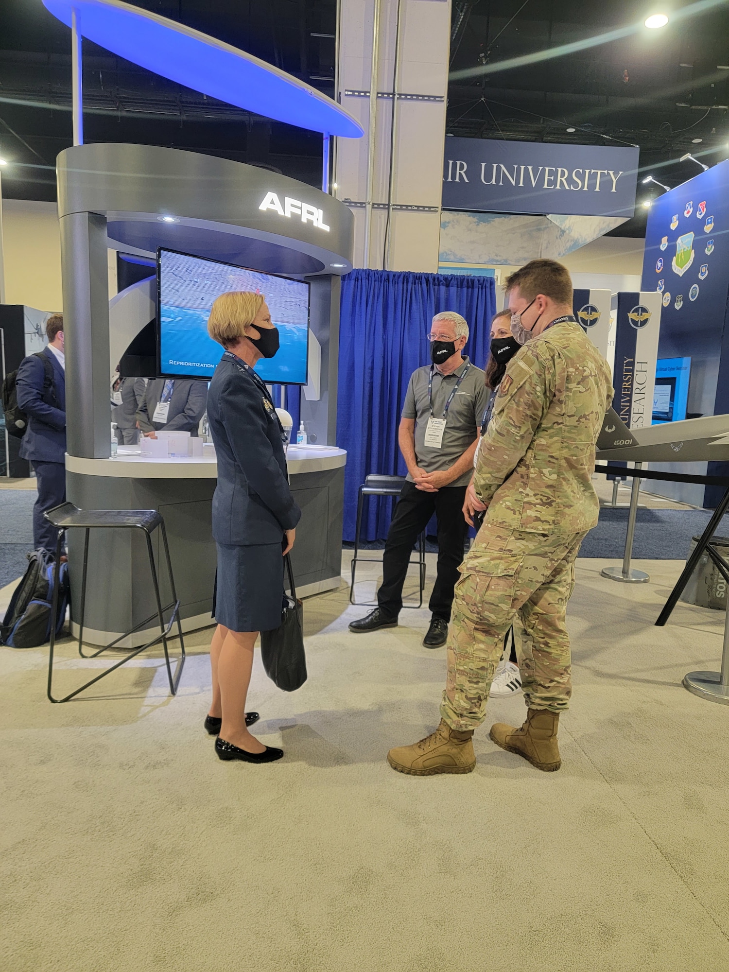 Maj. Gen. Heather Pringle, commander of the Air Force Research Laboratory, speaks with scientists and engineers at AFRL's exhibit booth at the Air Force Association's Air, Space & Cyber conference held in National Harbor, Maryland, Sept. 20-22, 2021. (U.S. Air Force photo/Steven Doub)