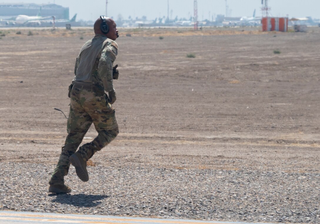 Tech. Sgt. Michael Jefferson, a loadmaster with the 779th Expeditionary Airlift Squadron, checks the outside of a C-130H Hercules at an undisclosed location in Southwest Asia, Sept. 16, 2021.