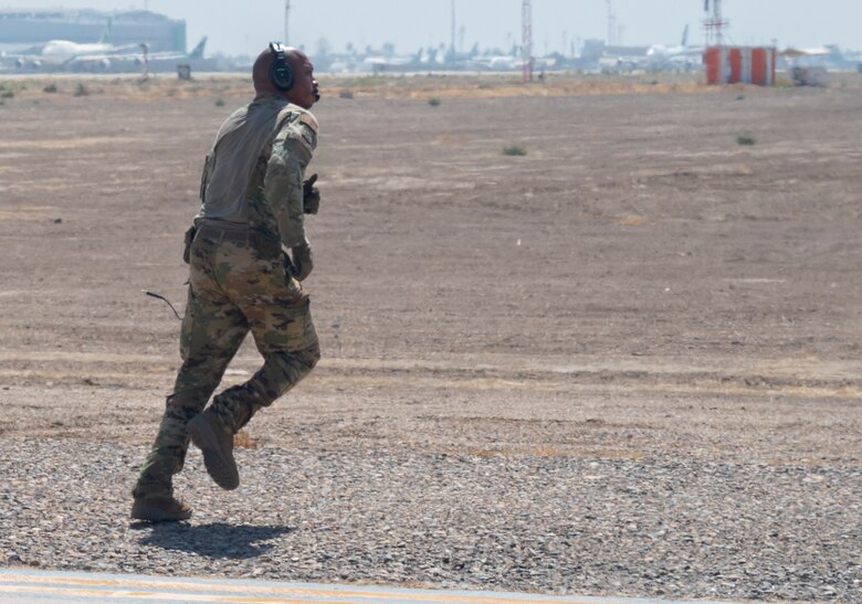Tech. Sgt. Michael Jefferson, a loadmaster with the 779th Expeditionary Airlift Squadron, checks the outside of a C-130H Hercules at an undisclosed location in Southwest Asia, Sept. 16, 2021.