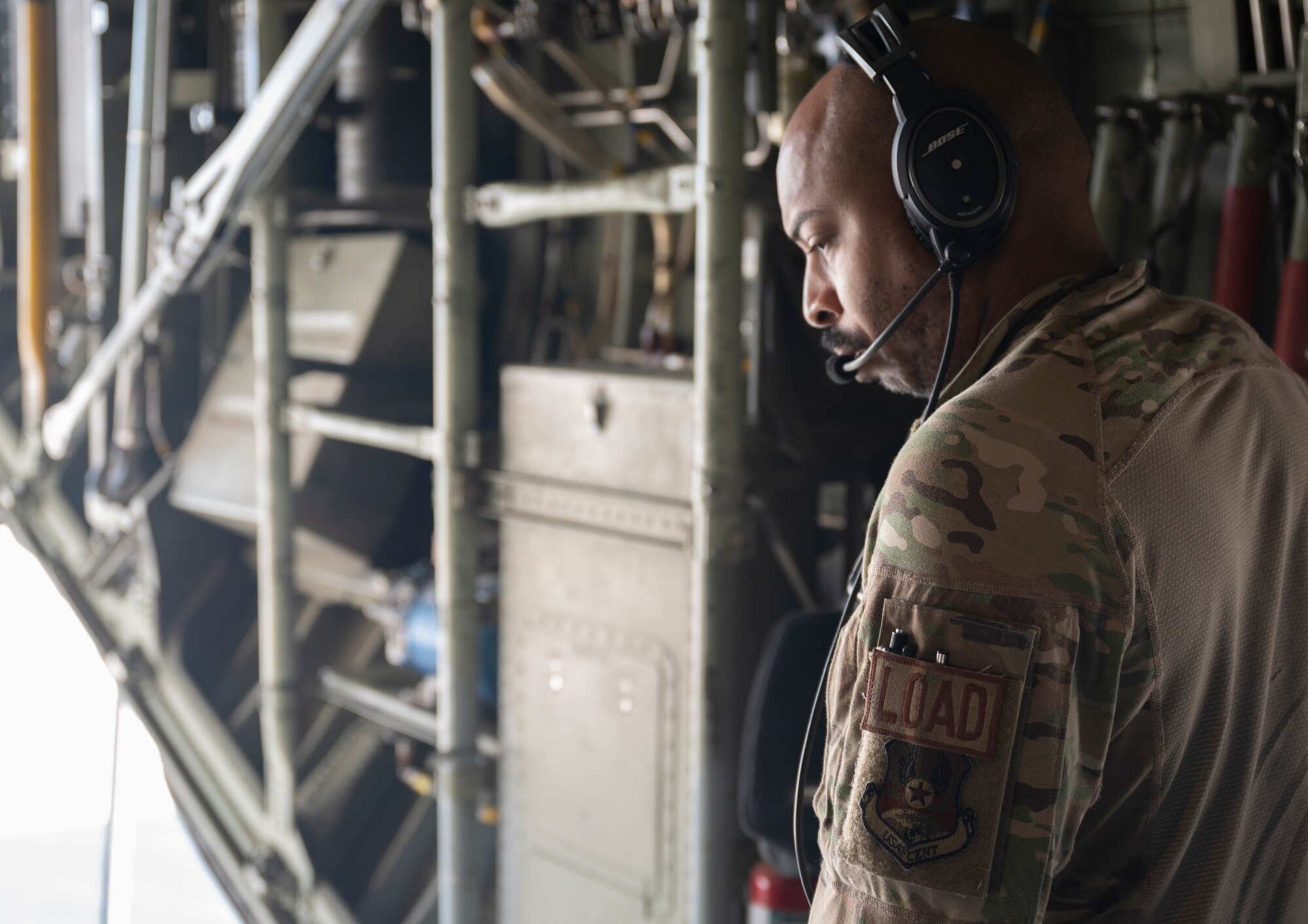 Tech. Sgt. Michael Jefferson, a loadmaster with the 779th Expeditionary Airlift Squadron, lowers the ramp of a C-130H Hercules in Iraq, Sept. 16, 2021.