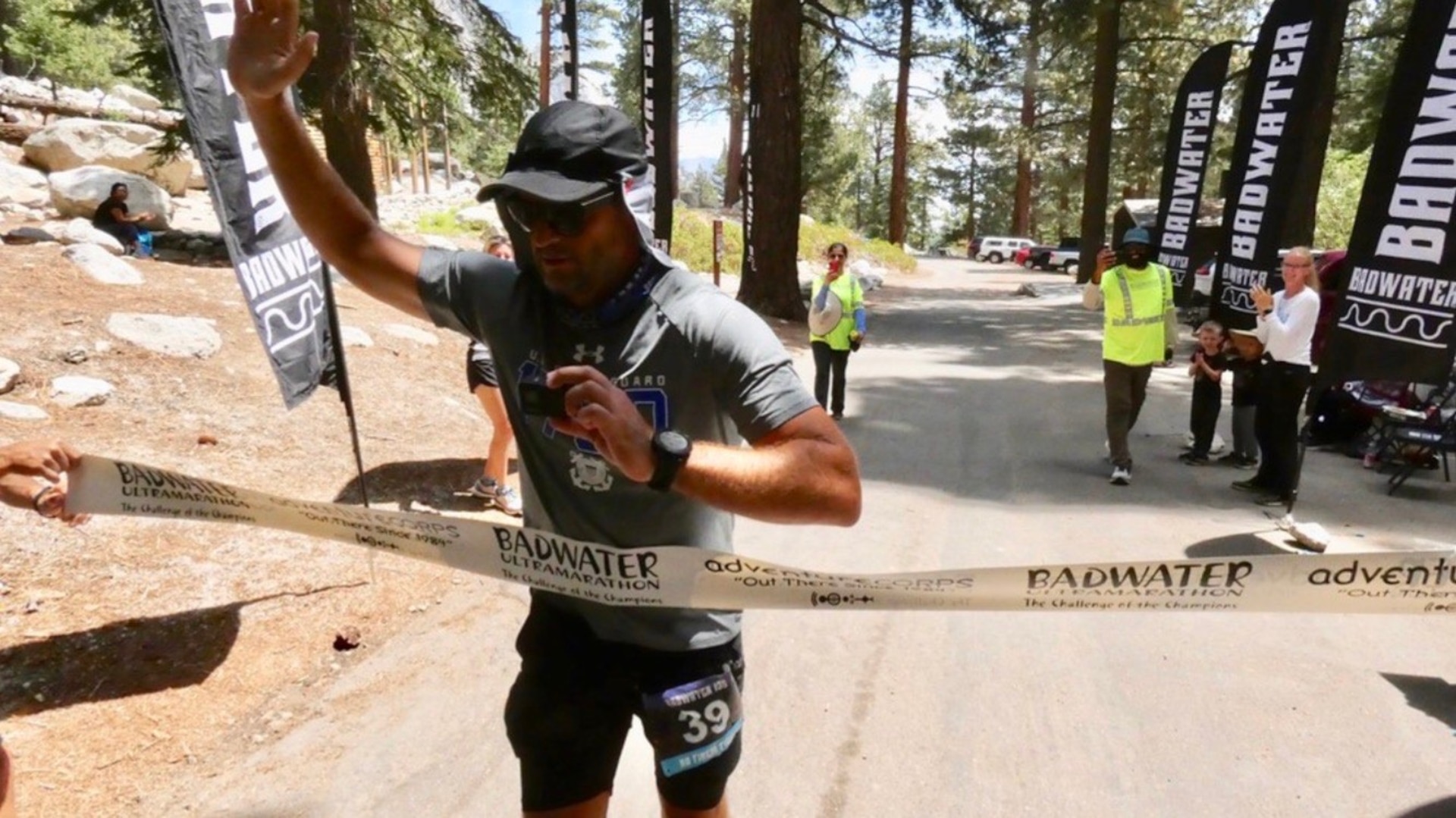 Seaman Nate Dirvin crosses the finish line after running 135 miles through Death Valley to Mount Whitney in California, July 19, 2021. He completed the Badwater 135 to raise funds for Coast Guard Mutual Assistance. U.S. Coast Guard photo.