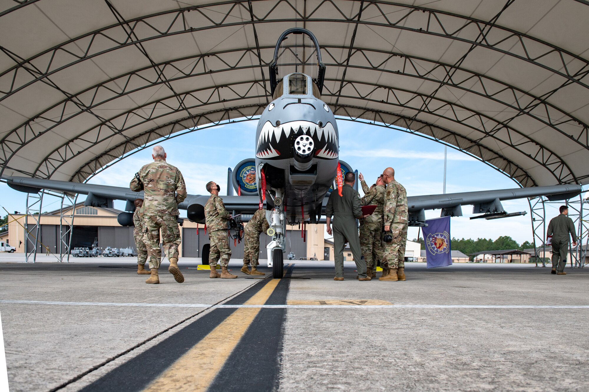 A photo of Airmen inspecting aircraft.