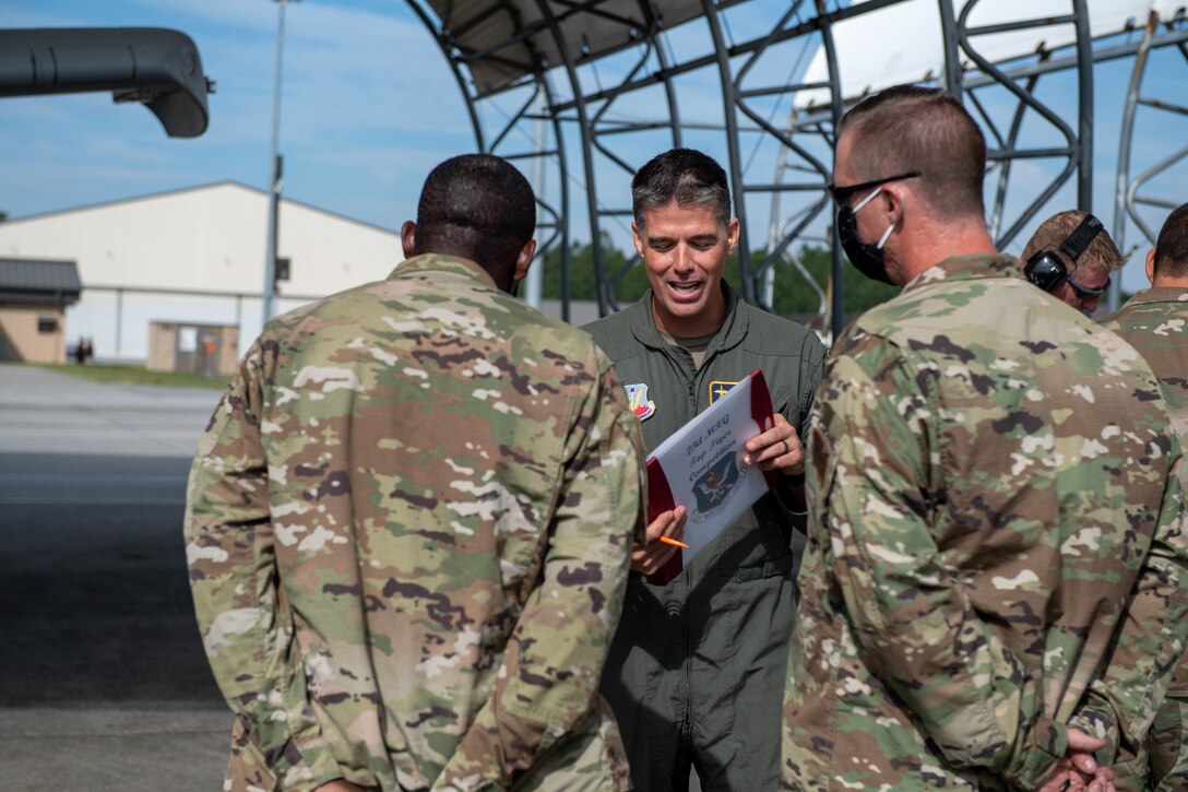 A photo of Airmen talking.