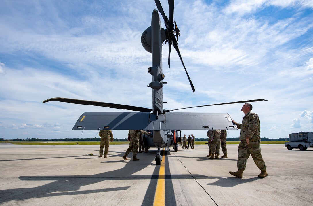 A photo of Airmen near aircraft.