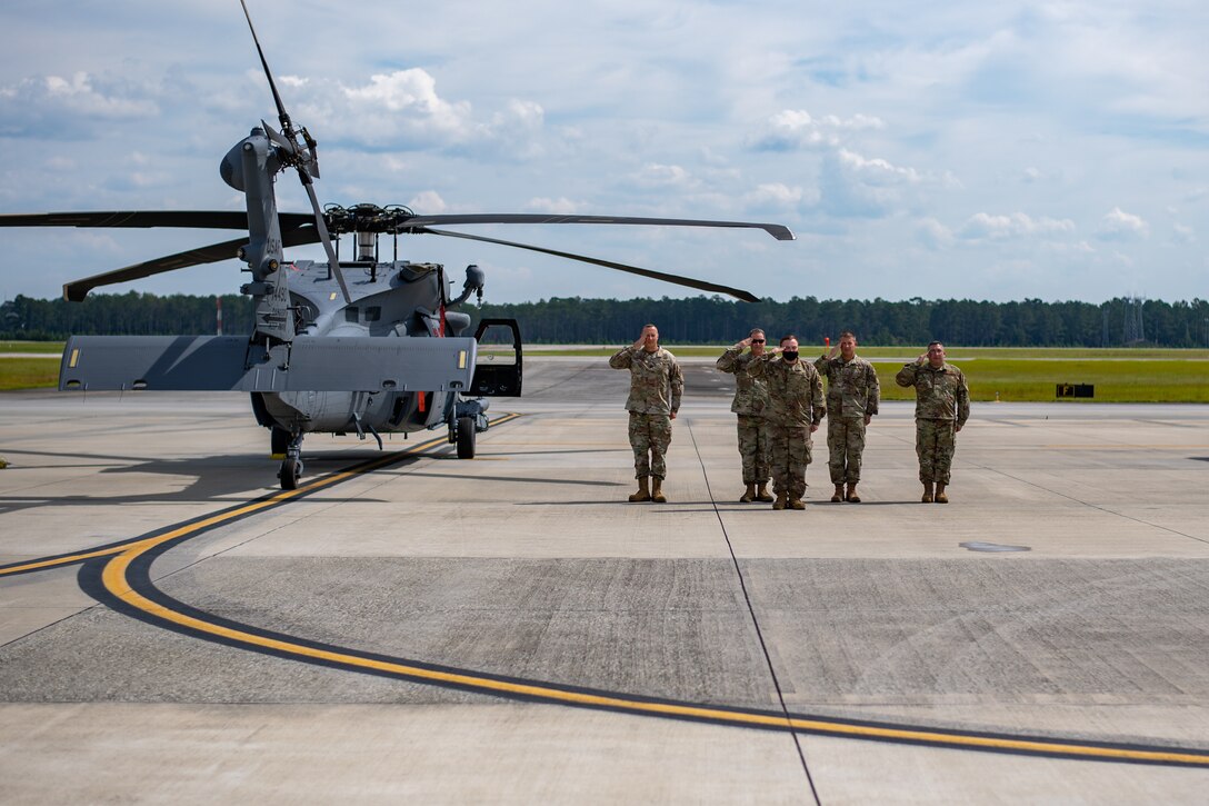 A photo of Airmen saluting.