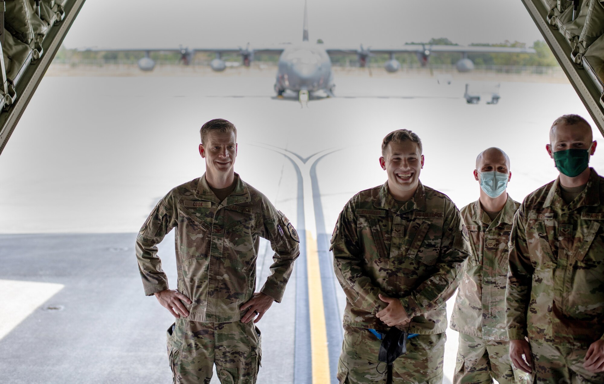 A photo of Airmen standing.