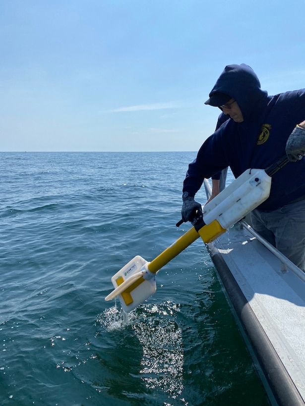 Dr. Alexis Catsambis retrieves the magnetometer after the surveying is complete.