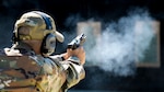 U.S. Air Force Senior Master Sgt. Justin Kelley, 177th Operations Squadron C2 operations senior enlisted leader, fires a Sig Sauer P320-M18 handgun Sep. 24, 2021, at the FAA William J. Hughes Technical Center, Egg Harbor Township, N.J. Members of the 177th FW went to the range to qualify for the M18.