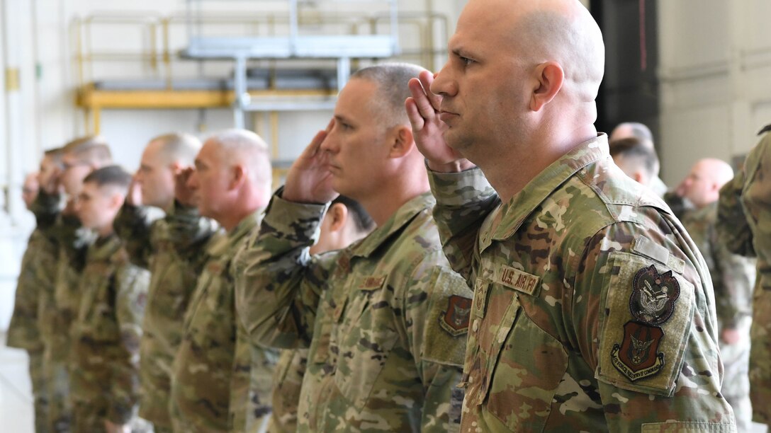 Reserve Citizen Airmen from the 910th Maintenance Squadron render a final salute to Lt. Col. George F. Lenahan, the outgoing 910th Maintenance Squadron Commander during a change of command ceremony Oct. 2, 2021, at Youngstown Air Reserve Station, Ohio.