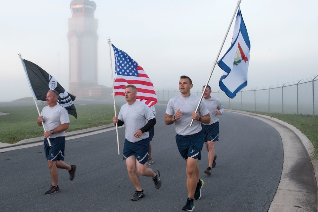 Members of the 167th Civil Engineering Squadron participate in the POW/MIA 12 Hour Remembrance Run/Walk held at the 167th Airlift Wing, Martinsburg, West Virginia, Oct. 2, 2021. Unit members carried the U.S., POW/MIA and West Virginia flag for the duration of the event, starting at 6:00 a.m. and ending at 6:00 p.m., to pay tribute to those who were prisoners of war and those still missing in action.