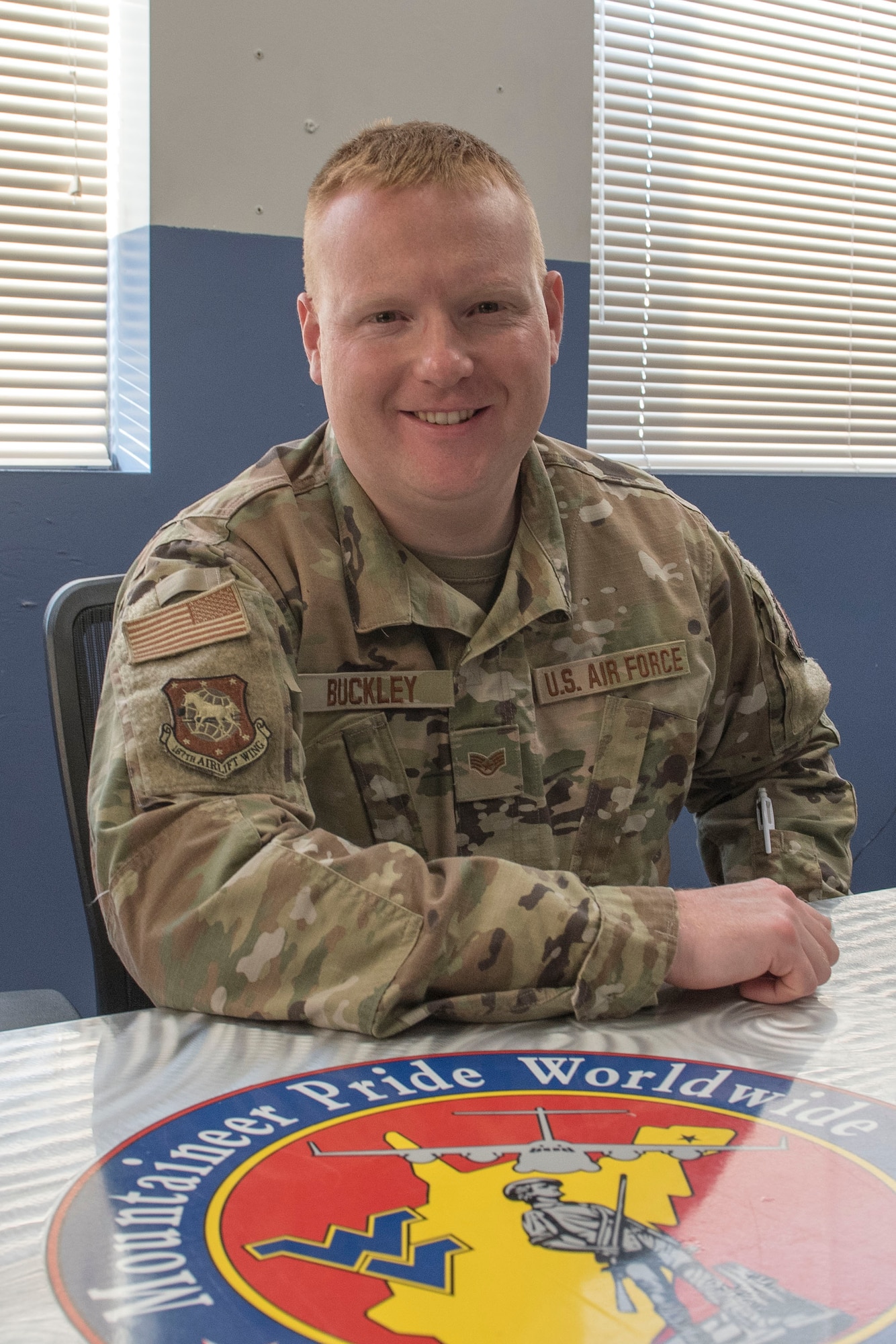 U.S. Air Force Staff Sgt. George Buckley, 167th Aircraft Maintenance Squadron crew chief, joined the 167th Airlift Wing, following his grandfather’s footsteps. His grandfather, Master Sgt. George Griffith, a C-130 Hercules aircraft flight engineer for the 167th Operations Group, died in an aircraft crash in 1992, but Buckley says he feels his grandfather is still with him. (U.S. Air National Guard photo by Senior Master Sgt. Emily Beightol-Deyerle)