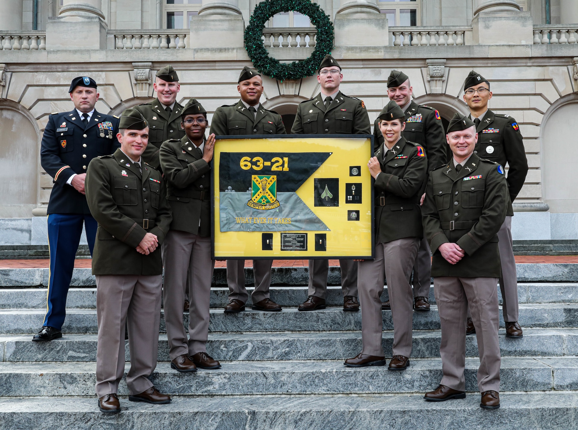 Class 63-21 pose in front of the State Capitol building after their officer commissioning ceremony in Frankfort, Ky., Sept. 27, 2021. The eight officer candidates from Officer Candidate School Class 63-21 became the Kentucky National Guard’s newest second lieutenants. (U.S. Army National Guard photo by Sgt. Jesse Elbouab)