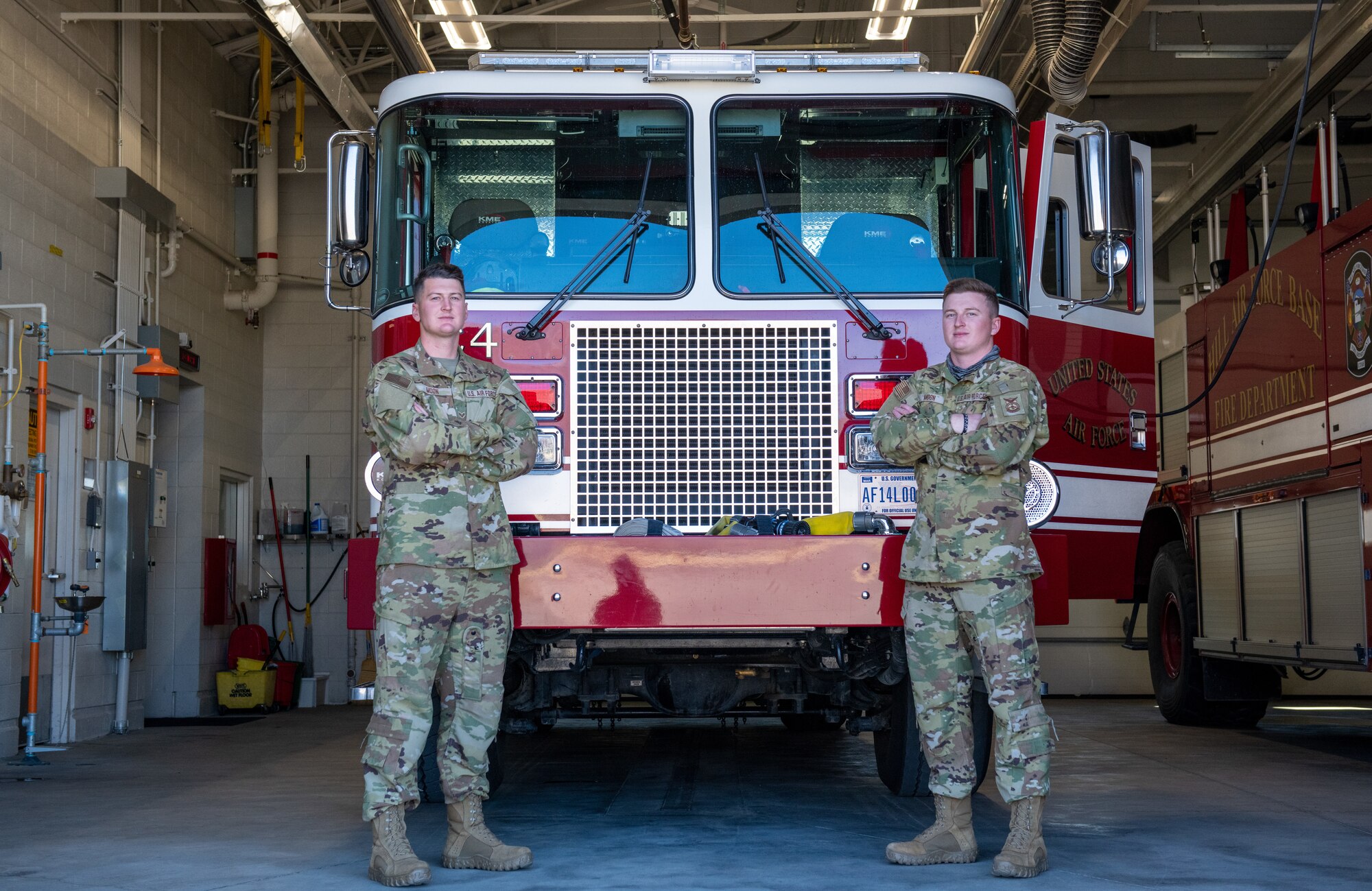 U.S. Air Force Senior Airman Jared Moon (left) poses with his brother, Senior Airman Joel Moon (right), at Hill Air Force Base, Utah on Oct. 3, 2021. The brothers joined the Air Force Reserve together and are currently firefighters with the 419th Civil Engineer Squadron.